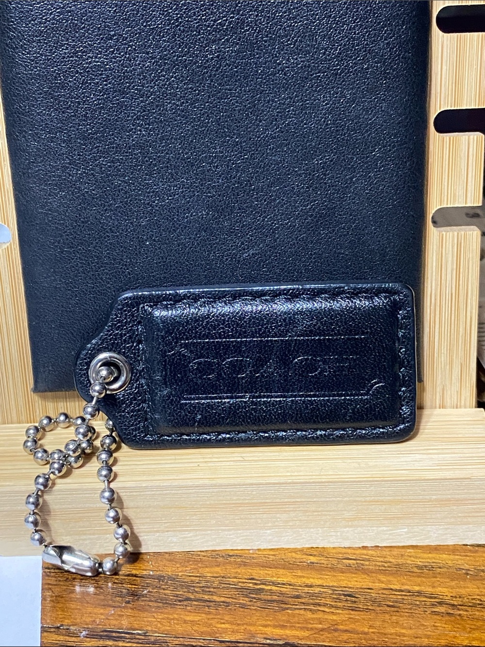 Coach black leather hand bag tag charm